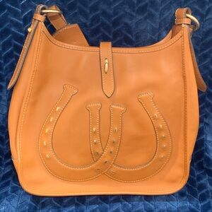 Dooney & Bourke brown leather horseshoe purse with blue bandanna print interior!